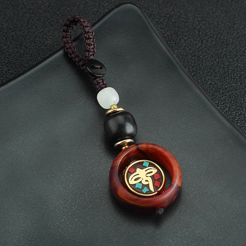 Buddha Stones Ebony Wood Sanskrit Four-leaf Clover Buddha's Eye Peace Rotatable Key Chain
