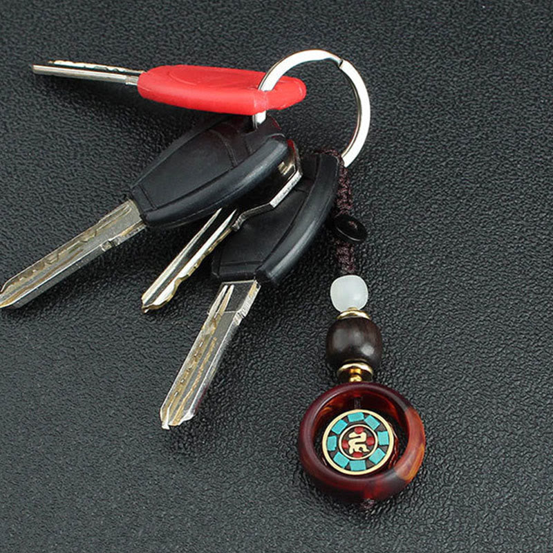 Buddha Stones Ebony Wood Sanskrit Four-leaf Clover Buddha's Eye Peace Rotatable Key Chain