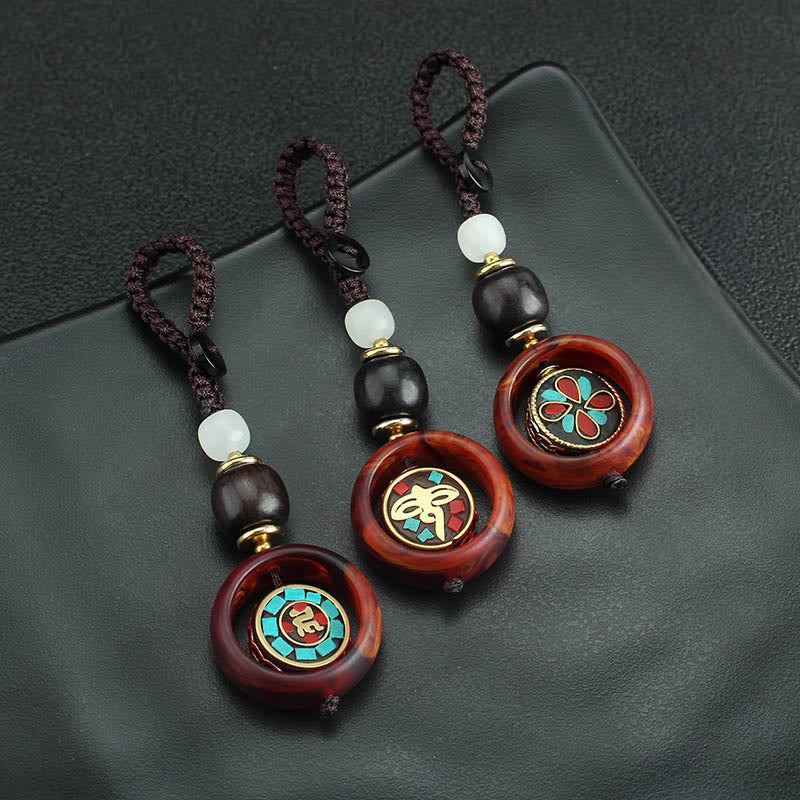 Buddha Stones Ebony Wood Sanskrit Four-leaf Clover Buddha's Eye Peace Rotatable Key Chain