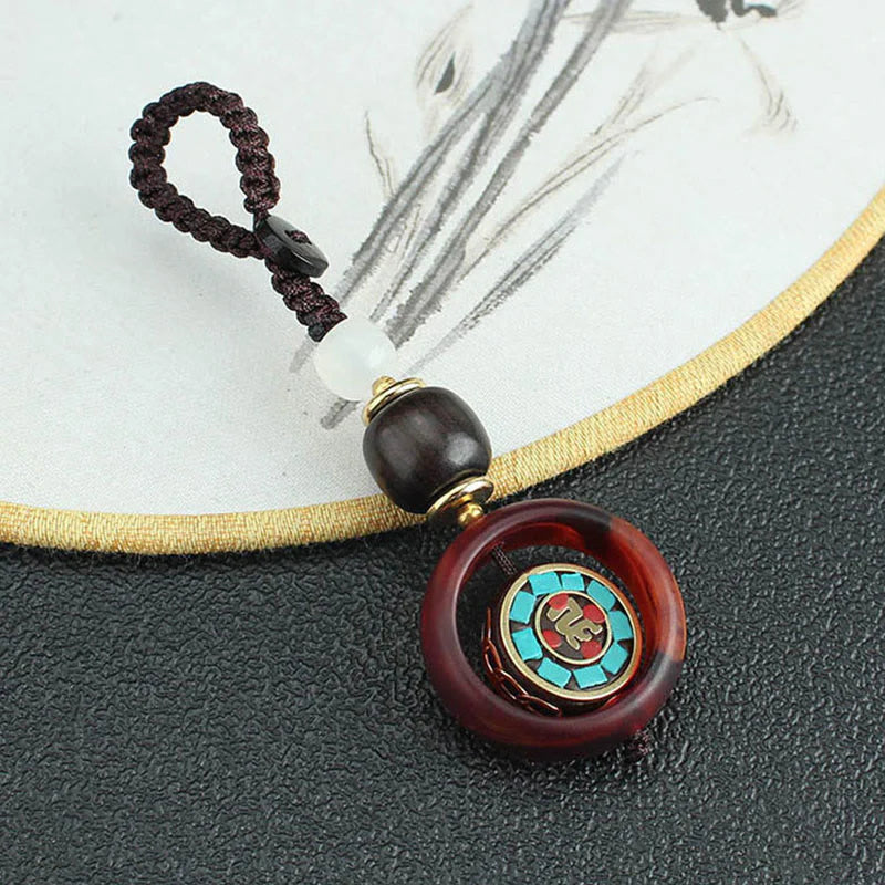 Buddha Stones Ebony Wood Sanskrit Four-leaf Clover Buddha's Eye Peace Rotatable Key Chain