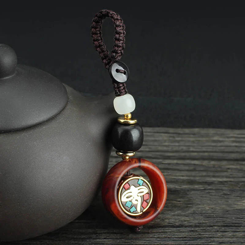 Buddha Stones Ebony Wood Sanskrit Four-leaf Clover Buddha's Eye Peace Rotatable Key Chain