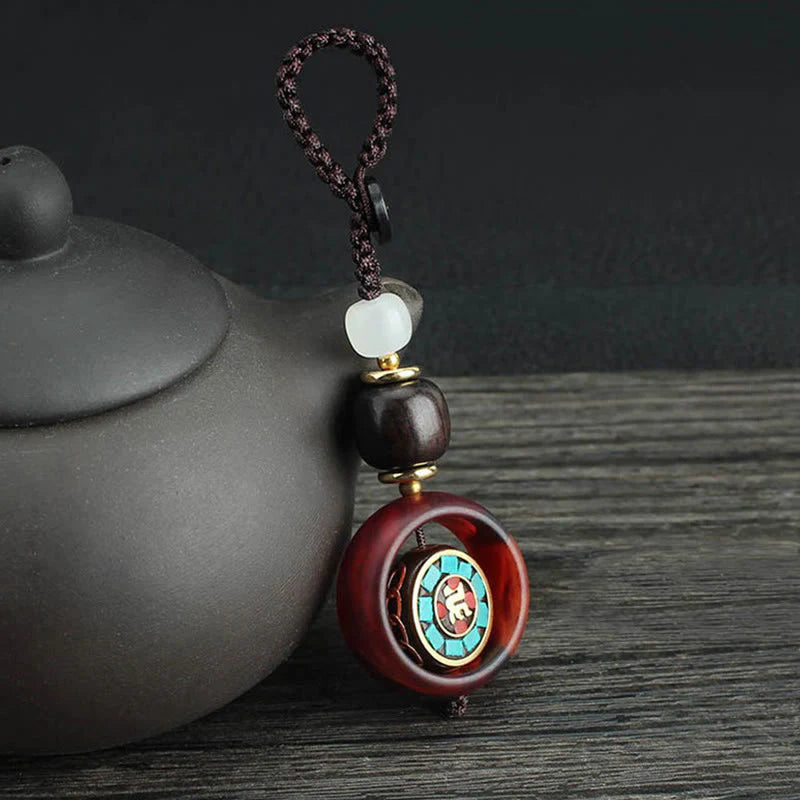 Buddha Stones Ebony Wood Sanskrit Four-leaf Clover Buddha's Eye Peace Rotatable Key Chain
